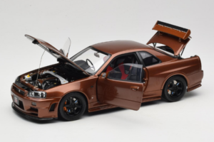 Nissan Skyline GT-R R34 Customized Metallic Bronze MotorHelix 1:18 M83414 Pressofusione — immagine 2 di 8